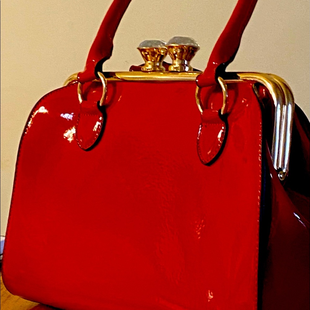 Beautiful stylish red handbag with shoulder strap